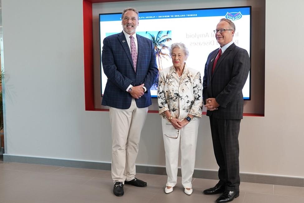 (From left): Michael R. Dobbs, M.D.; Ann Wood; and Curtis Whitehair, M.D., interim dean, FAU Charles E. Schmidt College of Medicine.